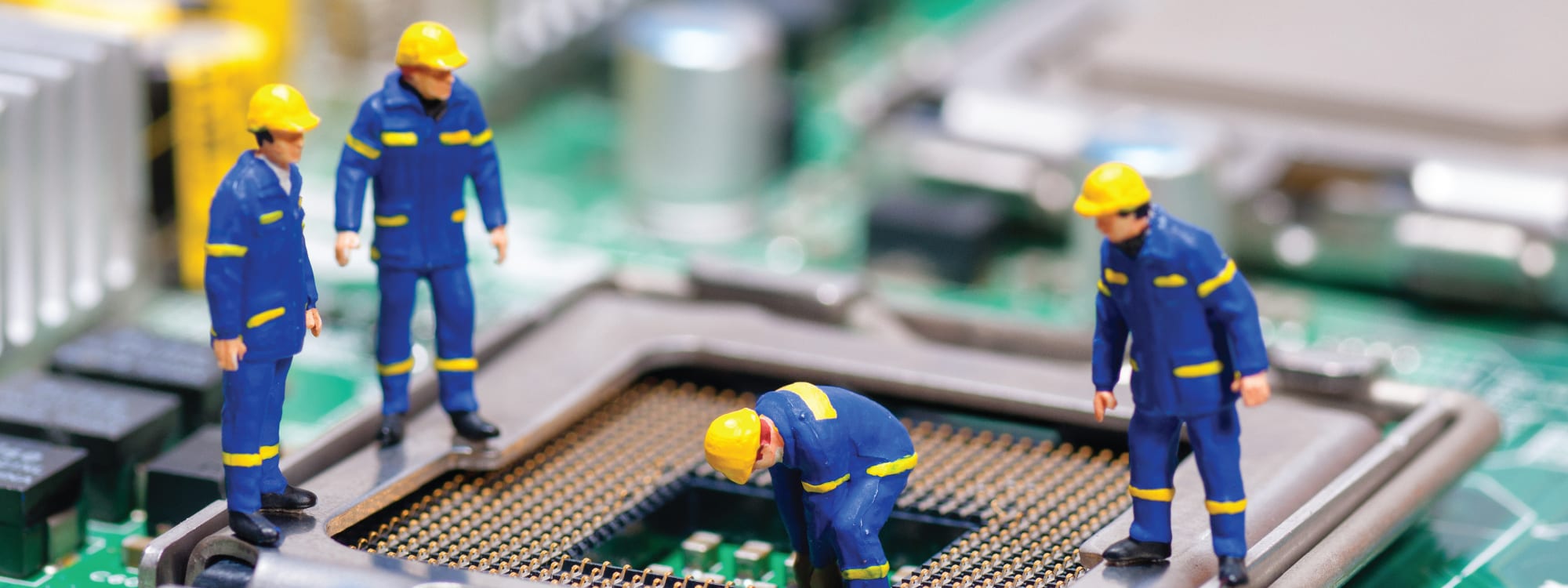 Toy figures working on hard drive