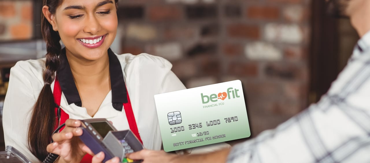 woman checking out someone with a debit card