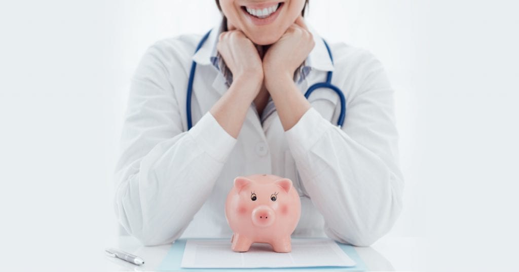 doctor propping their head up with their hands, piggy bank underneath them