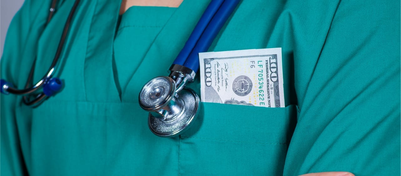 health care shirt pocket with a $100 bill in it