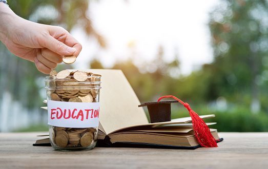 jar of coins that says education