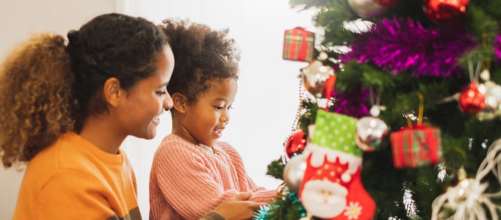 mother and child looking at christmas tree